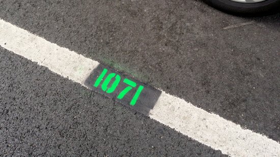 "1071" painted on the ground next to the speed van