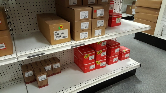 Shelves full of Wheelock products. The top shelf contains MIN-TR sounders, the middle section is RSS-MCW strobes, and next to that are ZNS horn/strobes. Then the bottom shelf contains Exceder horn/strobes on the left, and ZRS strobes on the right.