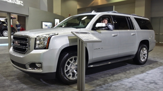 Sitting in a GMC Yukon XL SUV.