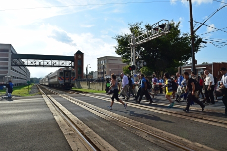 People crossing the street at the Gaithersburg MARC station, August 25, 2016