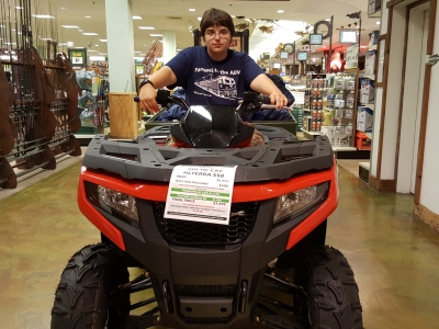 Elyse rides a four-wheeler