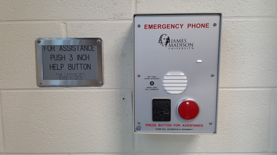 Remember how I wrote a quote article about these back in 2000? They have been replaced! In their place are the standard JMU emergency phones, where one press of the button calls campus police. This seems a better solution than the old intercom system for rescue assistance. Those old buttons would get hit so often that no one paid any attention to them. If someone hit one, it sounded an alarm at the main entrance, someone would press a button to stop the alarm, and that was that. Then campus police would just reset the system with a key when they were nearby, but even they knew that the system was worthless. The likelihood that someone would actually respond to a legitimate activation of the system via the old intercom was slim to none. The new implementation, where it contacts campus police directly, makes more sense.