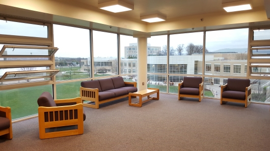 TV lounge, fourth floor, upperclass side. The College Center (now Festival Student Center) is in the background.