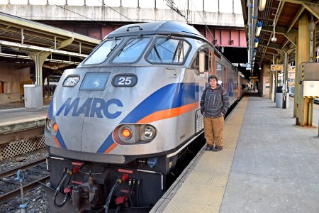 Elyse poses with MARC locomotive 25.