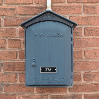 Gamewell fire alarm box on the side of a building