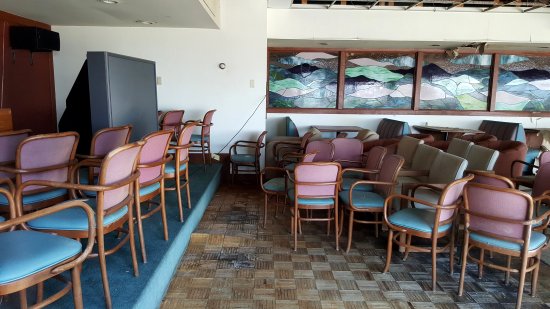 Meeting room of some sort. Note the water damage on the parquet flooring.