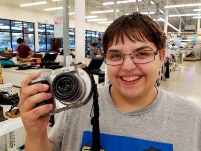 Elyse holds a "Big Mavica" type camera