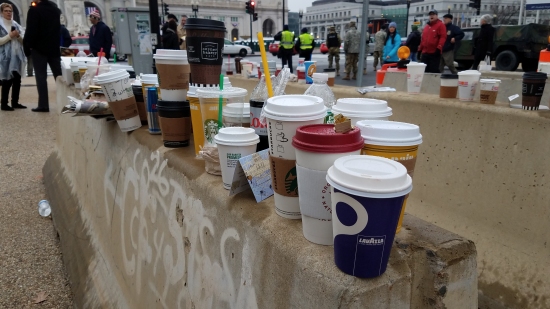 Jersey barriers became a makeshift dumping ground for drink cups and bottles. As I understand it, people couldn't bring any sort of items into the secure area with them, so this became a place to set down the drinks that they couldn't take with them. You have to wonder about the person who barely touched their Diet Coke before abandoning it, though...