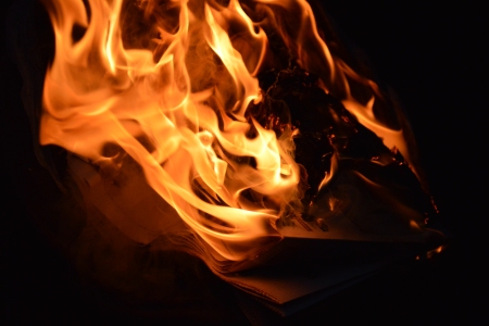 Close-up of the burning trash can.