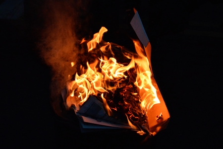 Close-up of the burning trash can.