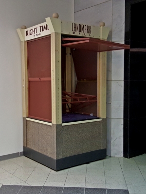 "Right Time By Wantai" kiosk, stored in a corner next to the upper level entrance to Lord & Taylor.