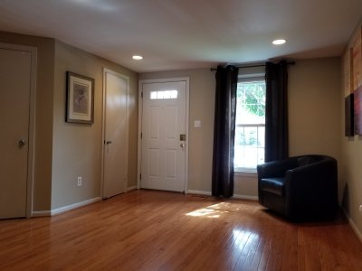 Living room, facing the front door.