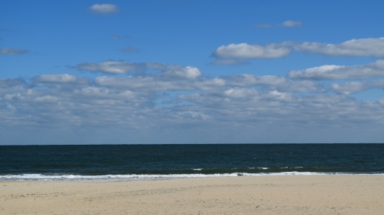 Only slight cloud cover over the beach.  Perfect photography weather.