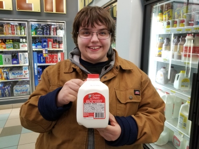 Quart-sized jug of milk, with Elyse for scale.