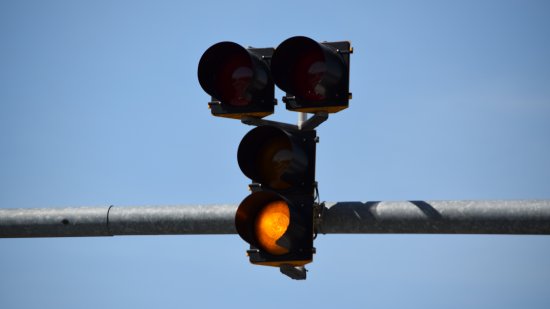 Flashing yellow light on the bottom.  This signal functioned more or less like a HAWK beacon, but unlike a true HAWK beacon, which goes completely dark when not activated, this signal has a flashing yellow light when it's not active.