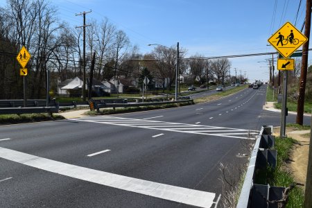 Westbound crossing.  Note the stop line and warning signs.