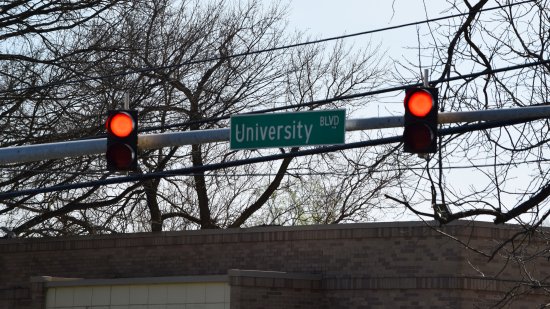 Signal for traffic on Reedie Drive.  Along with this signal, traffic on Reedie Drive also has a stop sign.