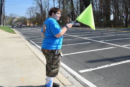 Elyse demonstrates the use of the crossing flag.