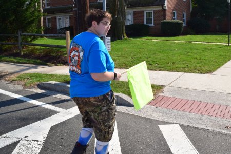 Elyse demonstrates the use of the crossing flag.