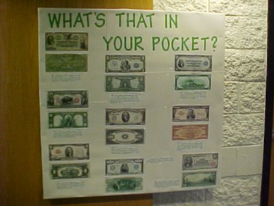 This October 2002 bulletin board was about old money.  It displayed versions of US currency that were no longer issued, as well as larger denominations that were only used for transferring funds between banks.