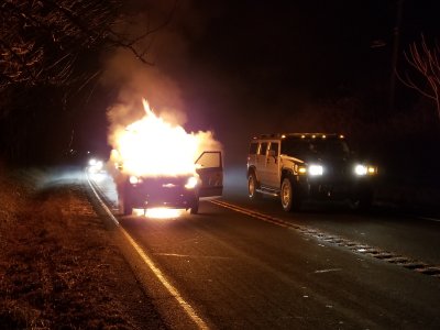 Twenty seconds later, the fire is much larger, and has spread to the passenger area.  The person driving the Hummer in the other lane inquired about how we were doing, and also called 911.