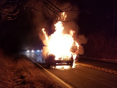 Two minutes later, the car is fully involved, with flames rising twice as high as the car.