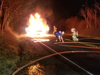 Two minutes later, the fire department was on scene.  Note that there's so much flame that you can barely even see the car.