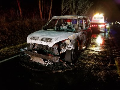 The remains of my Kia Soul, viewed from the front.  The fire had turned my green car white.