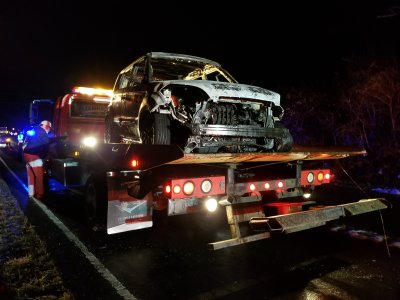 Loading the car onto the tow truck.  It was being taken to Terry's Body Shop in Purcellville.  That was a sad moment for me, because I knew that it was the last time that I would ever see my car.  And truthfully, that was fine - I never want to see the little fireball on wheels again.