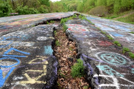 A long and relatively deep fissure in the road caused by ground subsidence.