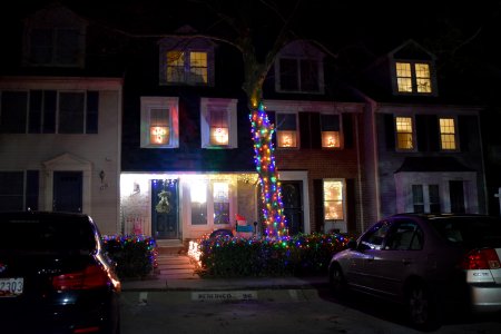 These were the only decorations of note on my street.  It appears that these two houses coordinated their efforts, as the decorations in the second-floor windows match, and the lighting on the hedges on both properties also matches.