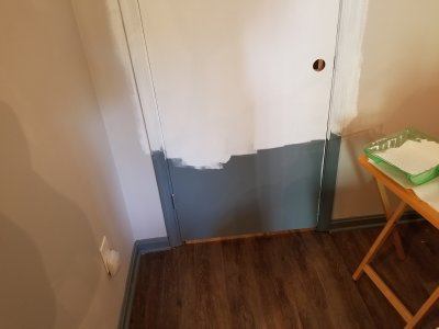 The main door to Elyse's room partially repainted.