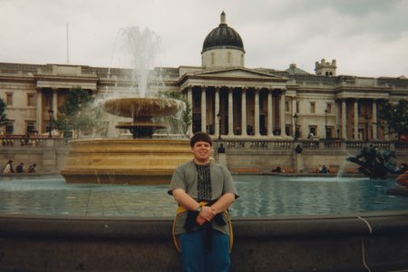 Standing in front of a fountain at Trafalgar Square