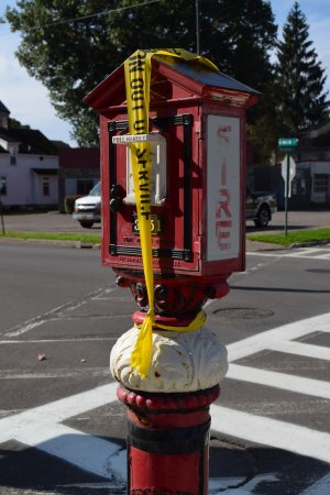 Municipal fire alarm box at North Main and Madison Streets.  Cortland previously had a municipal fire alarm box system, but that system is now in the process of being decommissioned.  Note the "not in service" tape over the handle.