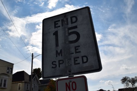 "End 15 mile speed" sign.