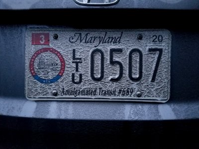 My rear license plate, covered in dirt.