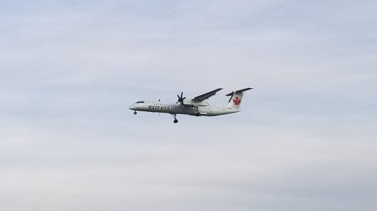 An Air Canada propeller plane that I caught with my phone because I had already put the camera away.  Unfortunately, I can't make out the tail number on this one.