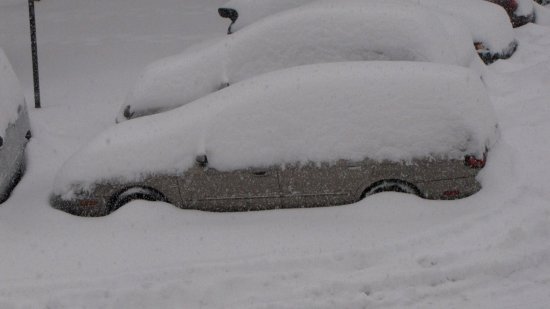 My car at the time, a Mercury Sable, covered with snow.