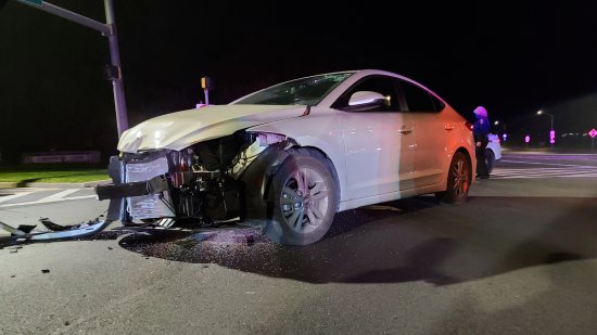 In this photo, note the damage to the windshield consistent with a head impact.