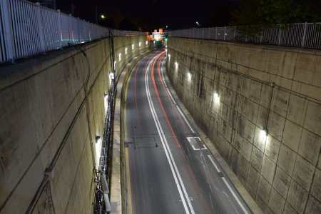 Stacked exposures of the Midtown Tunnel portal, showing taillight streaks.