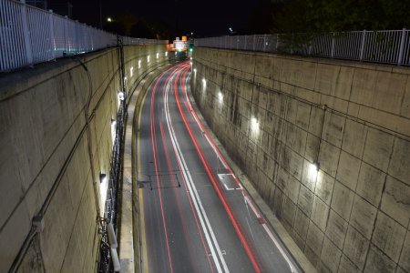 Stacked exposures of the Midtown Tunnel portal, showing taillight streaks.