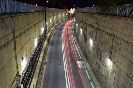 Stacked exposures of the Midtown Tunnel portal, showing taillight streaks.