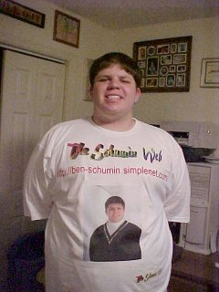 A photo that my sister took of me in June 2000, showing off a freshly made Schumin Web shirt