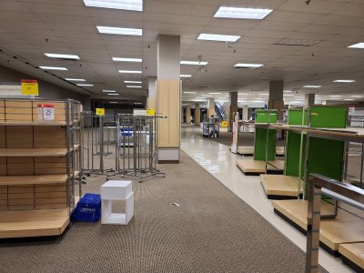 The closed-off section of the lower level of the store, being used to store spare fixtures.