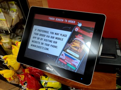 Sheetz started promoting their mobile app on their touchscreens.  I still used the touchscreen, though.  I imagine that the touchscreens are cleaned more often than most people's phones, too.