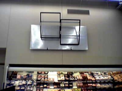New black wall and aisle signage going up in the grocery section.