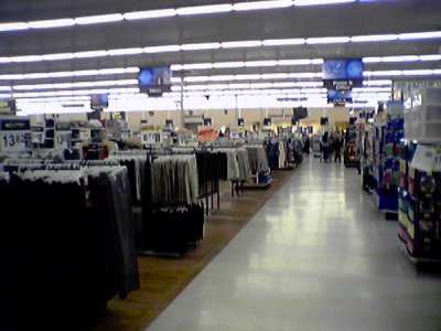 The clothing area, with new wood-look tile and signage.