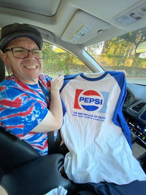 In the HR-V, holding up the "Birthplace of Pepsi" shirt that we got in New Bern.