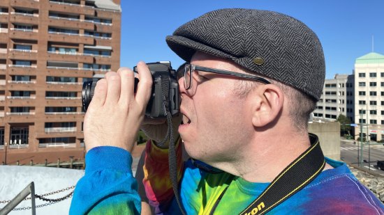 Touring the USS Wisconsin, and taking photos.  This is apparently how I look when I take photos: hat on, eye to viewfinder, mouth open, and neck skin hanging down like a turkey.  Remind me to thank Evan for this oh-so-flattering shot.