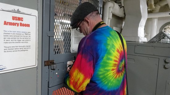 Taking a photo of a room through a slot in the door.